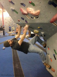 Photo of climber climbing at rock gym