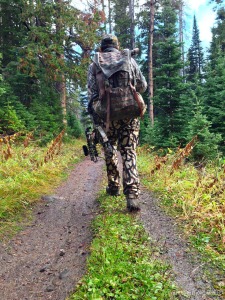 a bow hunter hiking
