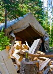 photo of chopping wood and walltent
